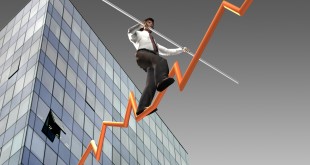 Businessman on a finance graphic aiming for the top