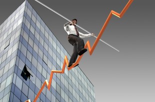 Businessman on a finance graphic aiming for the top