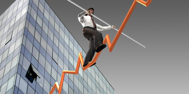 Businessman on a finance graphic aiming for the top