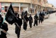 FILE - This undated file image posted on a militant website on Jan. 14, 2014, shows fighters from the Islamic State group marching in Raqqa, Syria. T (AP Photo/Militant Website, File)