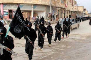 FILE - This undated file image posted on a militant website on Jan. 14, 2014, shows fighters from the Islamic State group marching in Raqqa, Syria. T (AP Photo/Militant Website, File)