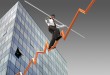 Businessman on a finance graphic aiming for the top